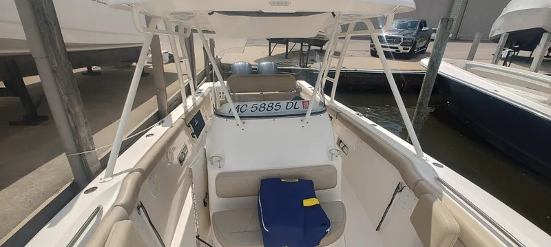 Slide: The Image of 2015 Pursuit S 280 Sport boat docked, featuring spacious seating and modern design. - 19