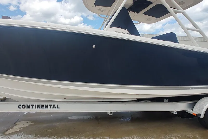 Slide: The Image of 2015 Pursuit S 280 Sport boat on Continental trailer, under cloudy sky. - 30