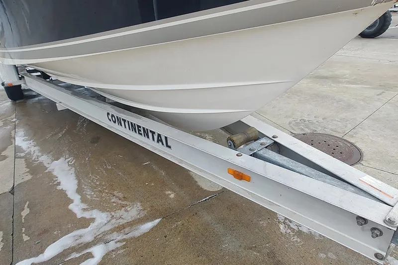 Slide: The Image of 2015 Pursuit S 280 Sport boat on Continental trailer, parked on wet pavement. - 33