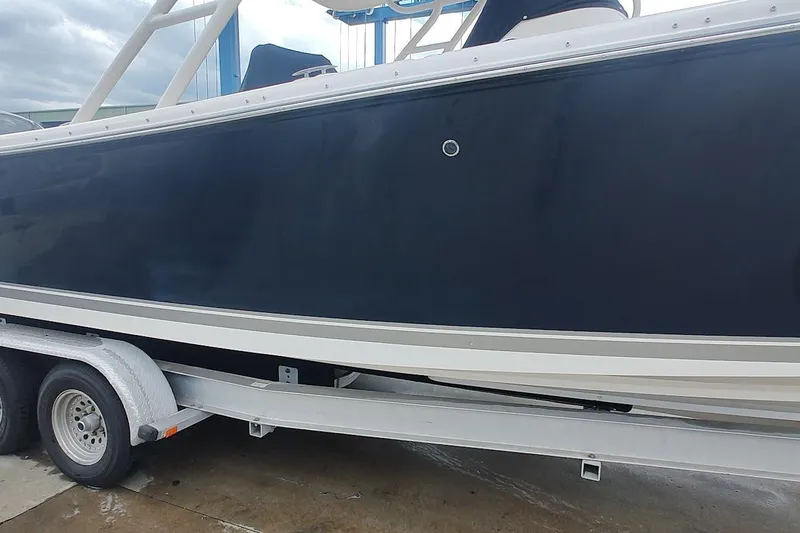 Slide: The Image of 2015 Pursuit S 280 Sport boat on trailer, side view. - 35