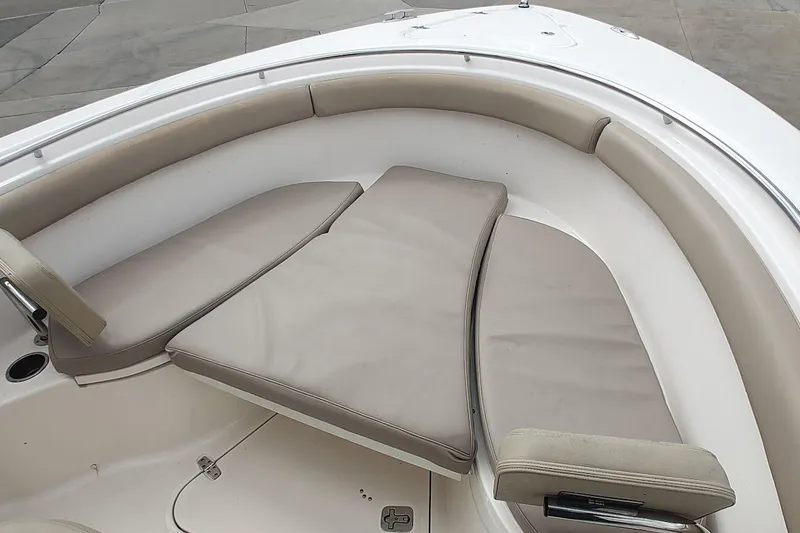 Slide: The Image of 2015 Pursuit S 280 Sport boat interior with cushioned seating area. - 39