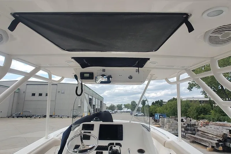 Slide: The Image of 2015 Pursuit S 280 Sport boat interior with steering wheel and control panel. - 40