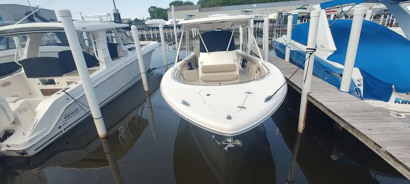 Slide: The Image of 2015 Pursuit S 280 Sport boat docked at marina, front view. - 7