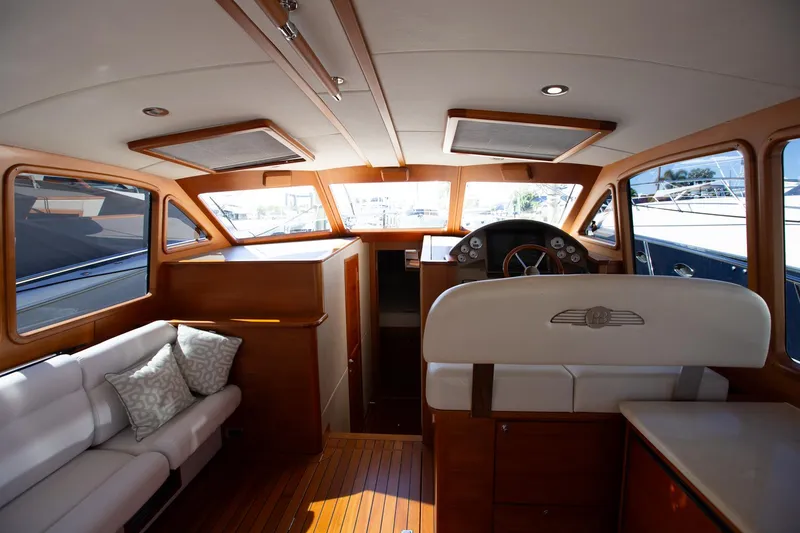 Slide: The Image of Luxurious interior of 2017 Palm Beach PB42 yacht with elegant wood finish and plush seating. - 14