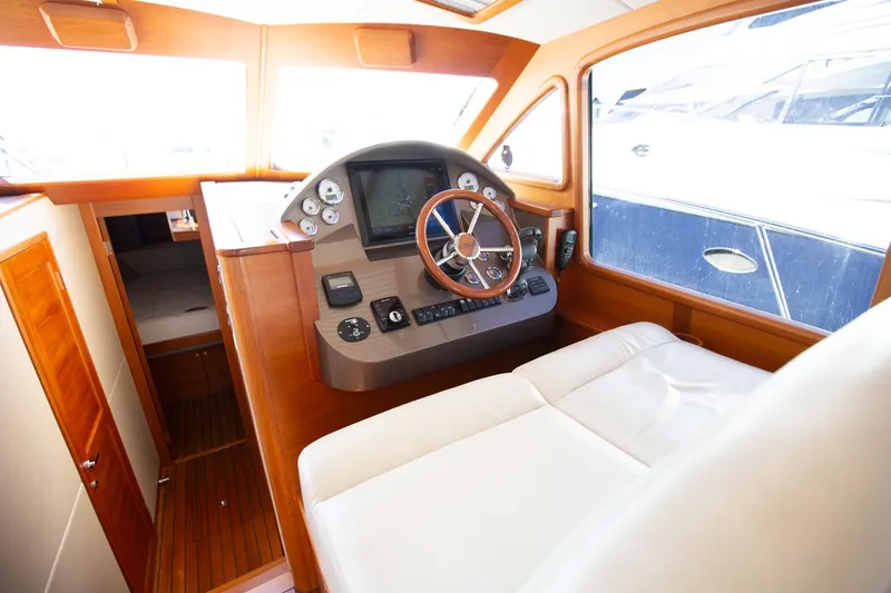 Slide: The Image of Interior of 2017 Palm Beach PB42 yacht with modern helm and luxurious seating. - 18