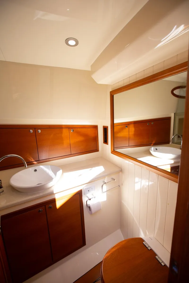 Slide: The Image of Luxurious bathroom in 2017 Palm Beach PB42 yacht with wooden cabinets and modern fixtures. - 22