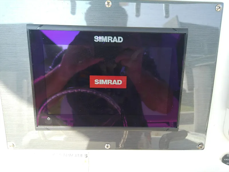 Slide: The Image of Simrad display on 2004 Trophy 2503 Center Console boat dashboard. - 24