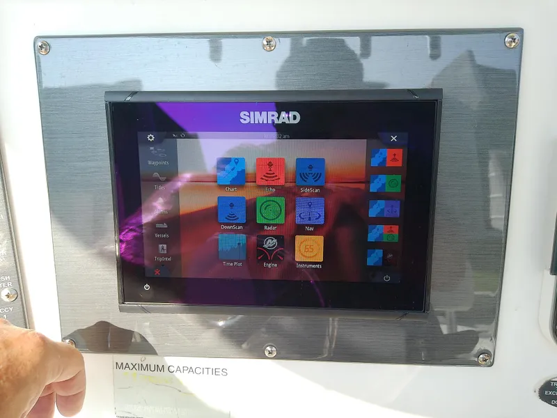 Slide: The Image of Simrad display on 2004 Trophy 2503 Center Console boat dashboard. - 25