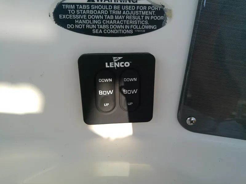 Slide: The Image of Lenco trim tab controls on 2004 Trophy 2503 Center Console boat. - 30