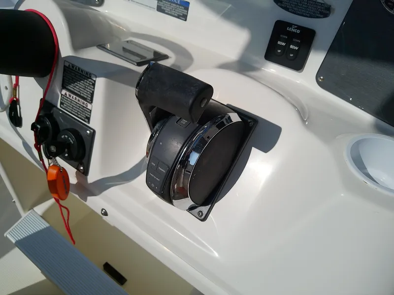 Slide: The Image of Close-up of 2004 Trophy 2503 Center Console boat throttle controls. - 31