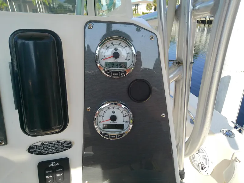 Slide: The Image of Close-up of 2004 Trophy 2503 Center Console boat dashboard with gauges. - 32