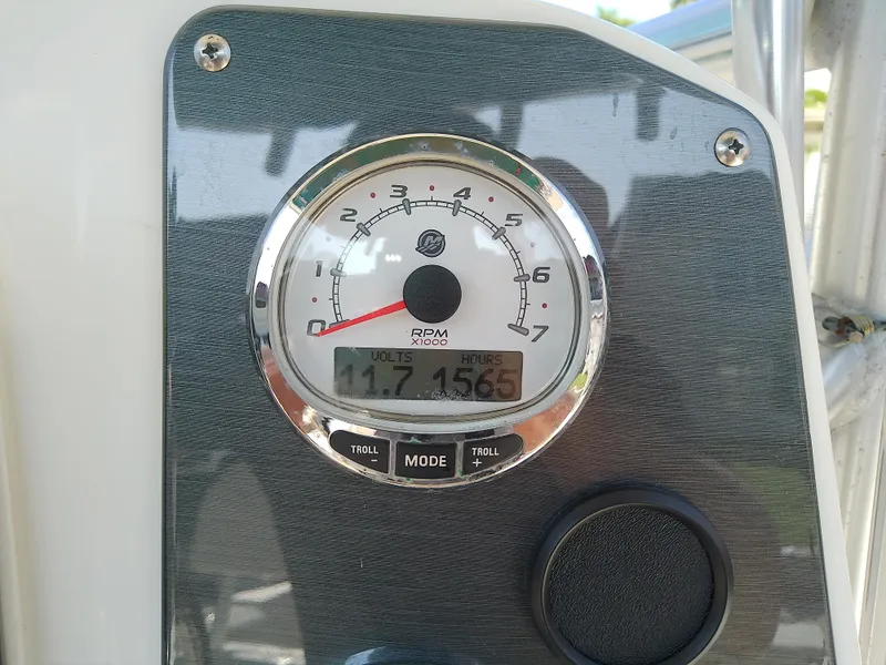 Slide: The Image of Tachometer on 2004 Trophy 2503 Center Console boat dashboard, showing RPM and engine hours. - 33