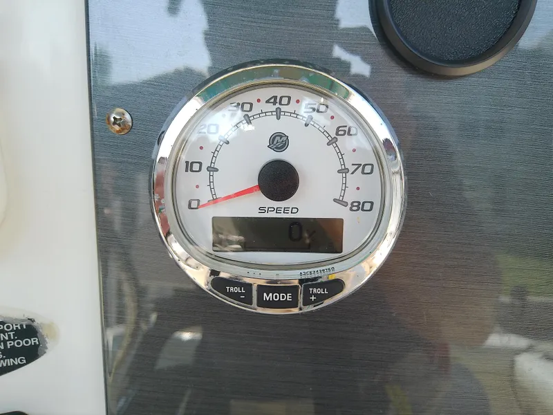 Slide: The Image of Speedometer of 2004 Trophy 2503 Center Console boat dashboard. - 34