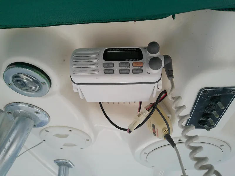 Slide: The Image of 2004 Trophy 2503 Center Console boat radio and control panel. - 35