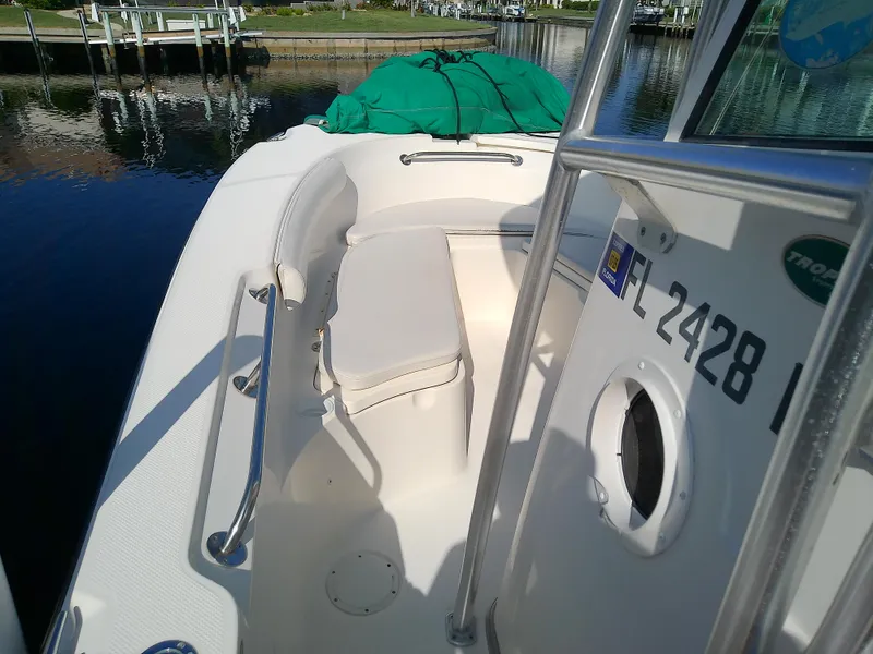 Slide: The Image of 2004 Trophy 2503 Center Console boat docked by the water. - 39