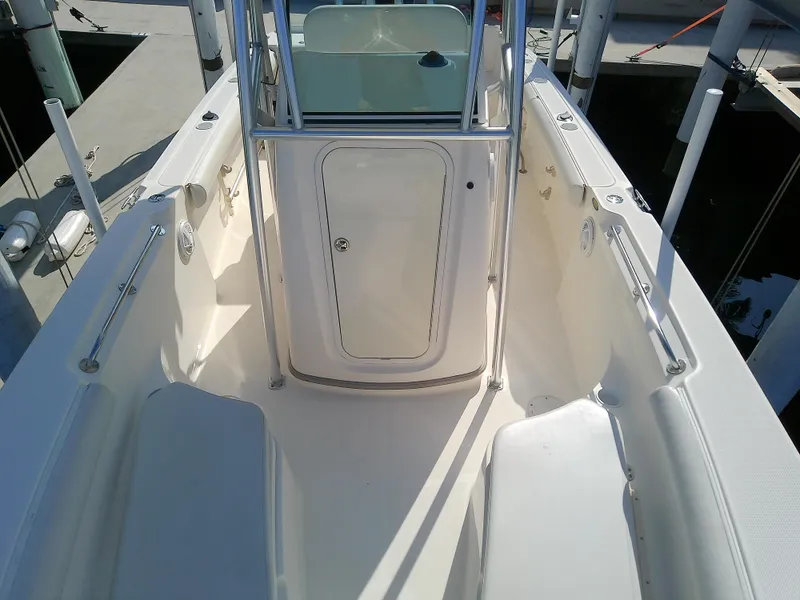 Slide: The Image of 2004 Trophy 2503 Center Console boat interior with seating and storage. - 40