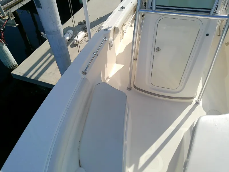 Slide: The Image of 2004 Trophy 2503 Center Console boat interior with seating and storage. - 42