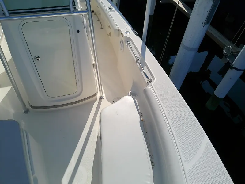Slide: The Image of 2004 Trophy 2503 Center Console boat interior with seating and storage. - 43