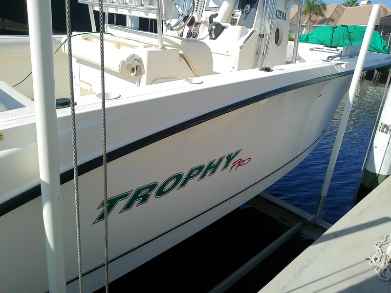Slide: The Image of 2004 Trophy 2503 Center Console boat docked at marina. - 5