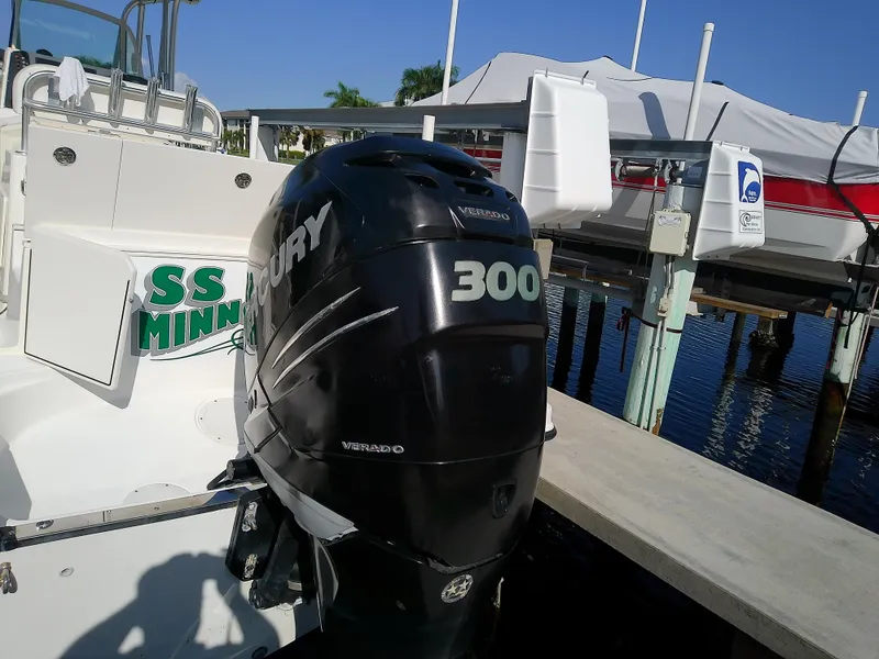 Slide: The Image of 2004 Trophy 2503 Center Console with Mercury 300 outboard engine at dock. - 7