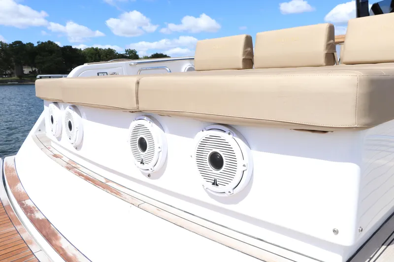 Slide: The Image of 2024 Pardo Yachts P43 with beige seating and built-in speakers on deck. - 18