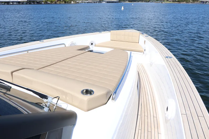 Slide: The Image of 2024 Pardo Yachts P43 with spacious deck and luxurious seating on calm waters. - 23