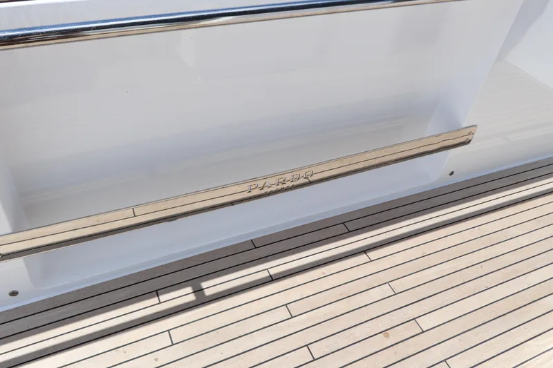 Slide: The Image of 2024 Pardo Yachts P43 deck with sleek wood finish and stainless steel railing. - 29
