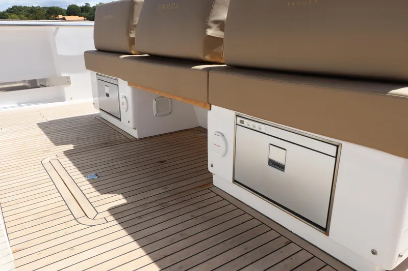 Slide: The Image of 2024 Pardo Yachts P43 deck with cushioned seating and storage compartments. - 35