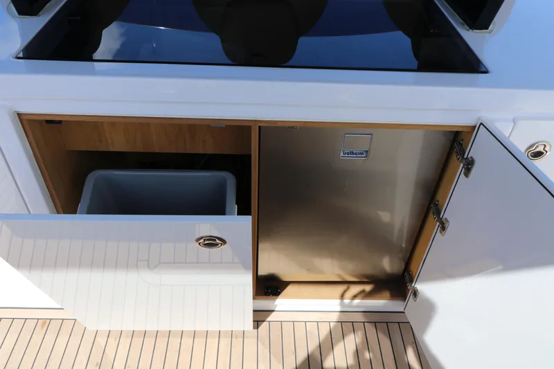 Slide: The Image of 2024 Pardo Yachts P43 interior with open cabinet and refrigerator. - 36