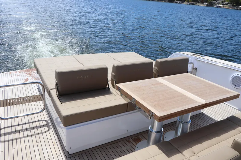 Slide: The Image of 2024 Pardo Yachts P43 deck with seating and table on open water. - 17