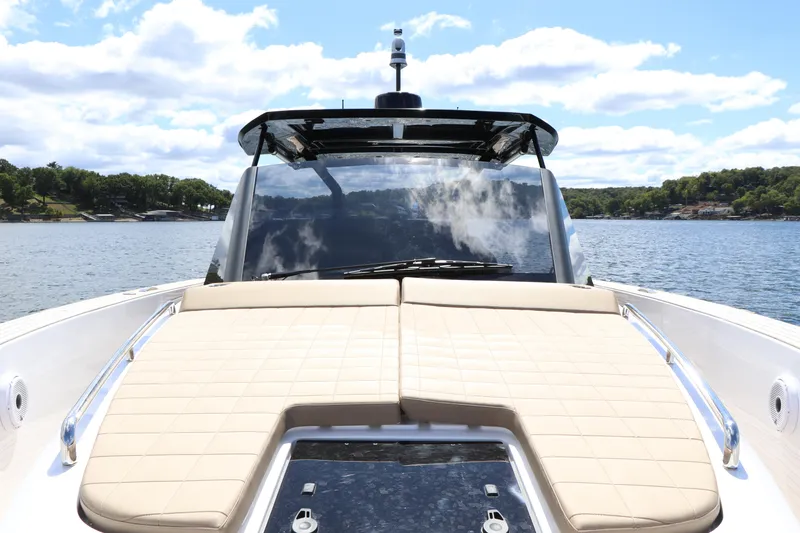 Slide: The Image of 2024 Pardo Yachts P43 luxury yacht with sunbathing deck on serene water. - 24