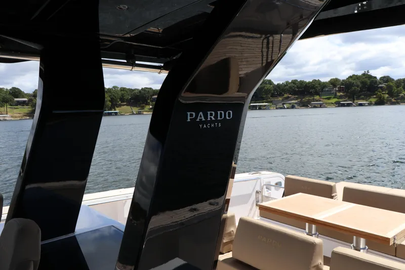 Slide: The Image of 2024 Pardo Yachts P43 on a serene lake, showcasing sleek design and luxury seating. - 27