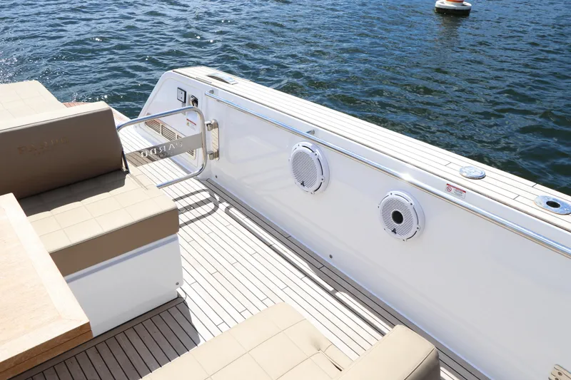 Slide: The Image of 2024 Pardo Yachts P43 deck with seating, overlooking calm water. - 28