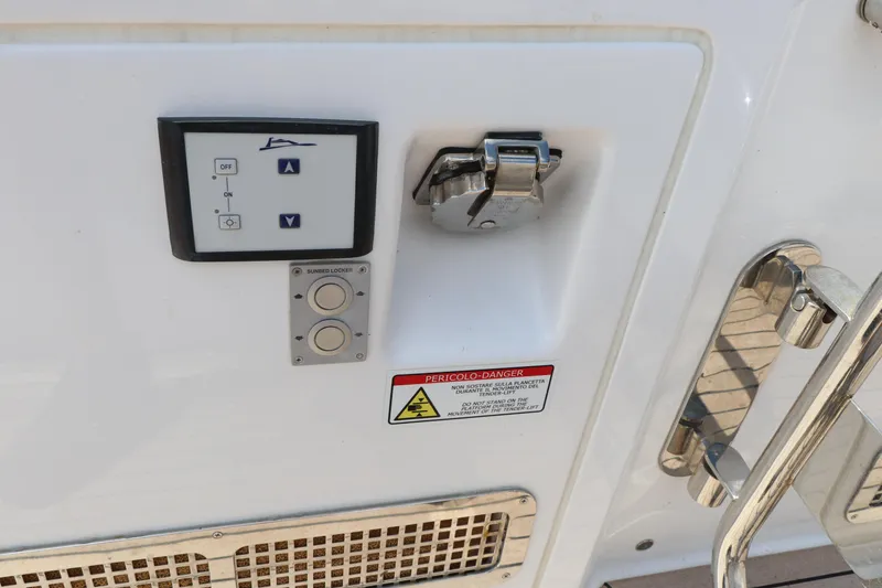 Slide: The Image of Control panel on 2024 Pardo Yachts P43, featuring buttons and safety warning. - 32