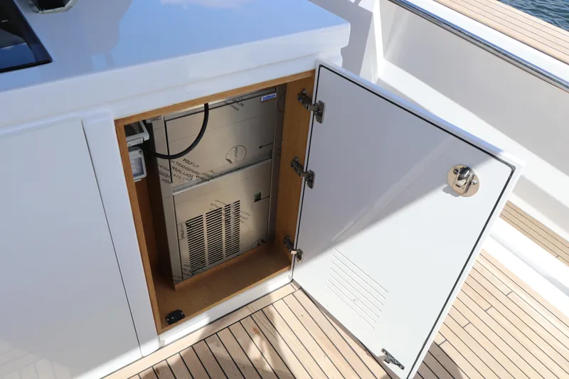 Slide: The Image of Open cabinet on 2024 Pardo Yachts P43, revealing interior equipment on deck. - 37