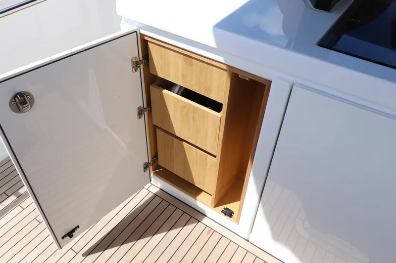 Slide: The Image of Open cabinet with wooden drawers on 2024 Pardo Yachts P43 deck. - 38