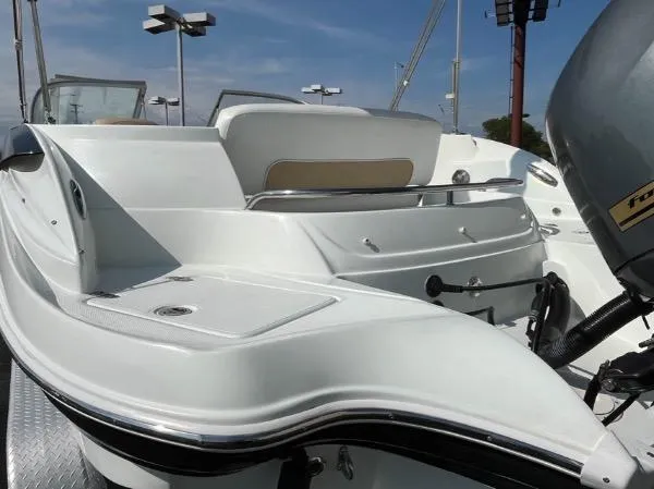 Slide: The Image of 2014 SouthWind 2200 SD boat with sleek white design and powerful engine. - 12
