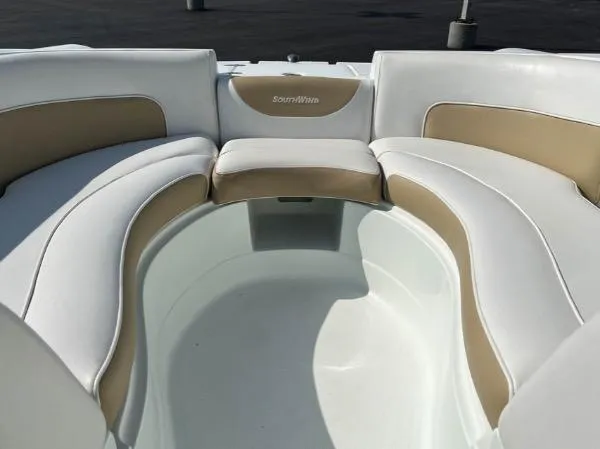 Slide: The Image of 2014 SouthWind 2200 SD boat interior with white and beige seating. - 13