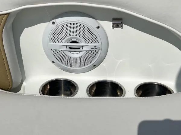 Slide: The Image of 2014 SouthWind 2200 SD boat speaker and cup holders in white interior. - 17