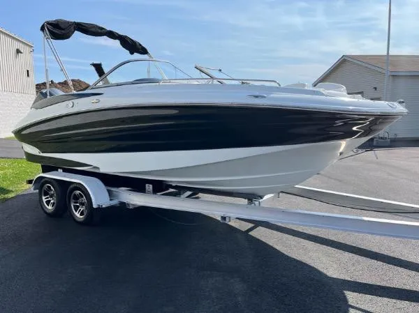 Slide: The Image of 2014 SouthWind 2200 SD boat on trailer, black and white design, parked outdoors. - 2