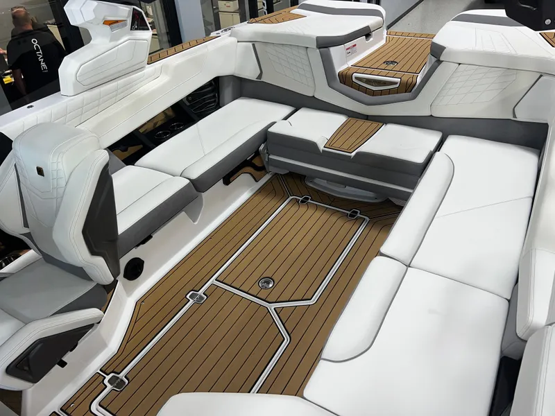 Slide: The Image of 2023 Nautique Super Air G23 interior with white seating and teak flooring. - 20