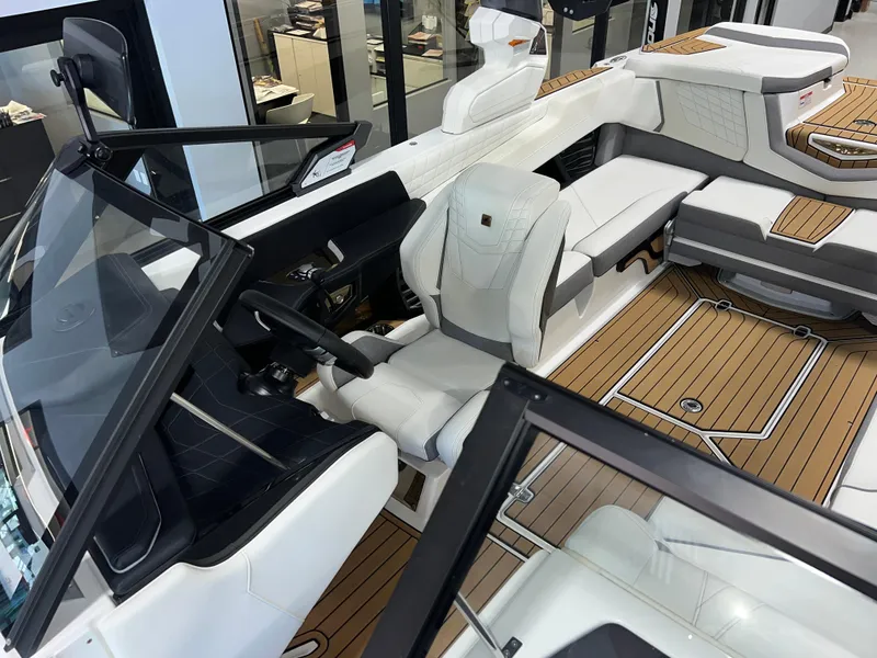 Slide: The Image of 2023 Nautique Super Air G23 boat interior with luxurious seating and modern design. - 21