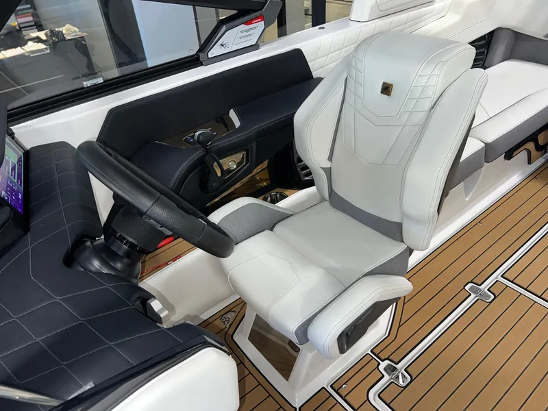 Slide: The Image of 2023 Nautique Super Air G23 cockpit with luxury seating and modern controls. - 22
