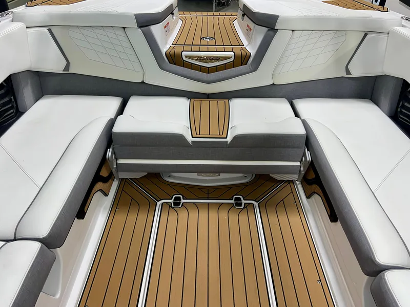Slide: The Image of 2023 Nautique Super Air G23 interior with luxurious seating and teak-style flooring. - 26