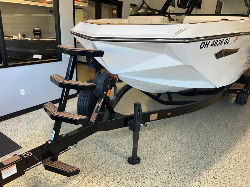 Slide: The Image of 2023 Nautique Super Air G23 boat on trailer in showroom. - 3