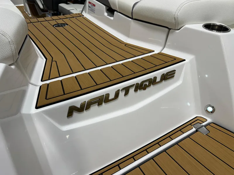Slide: The Image of 2023 Nautique Super Air G23 boat deck with teak-style flooring. - 31