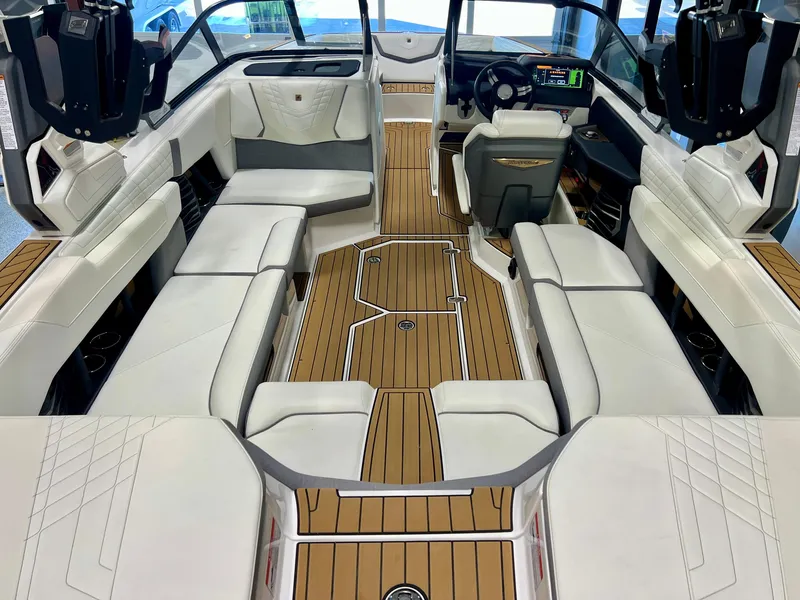 Slide: The Image of 2023 Nautique Super Air G23 interior with luxurious seating and modern dashboard. - 32