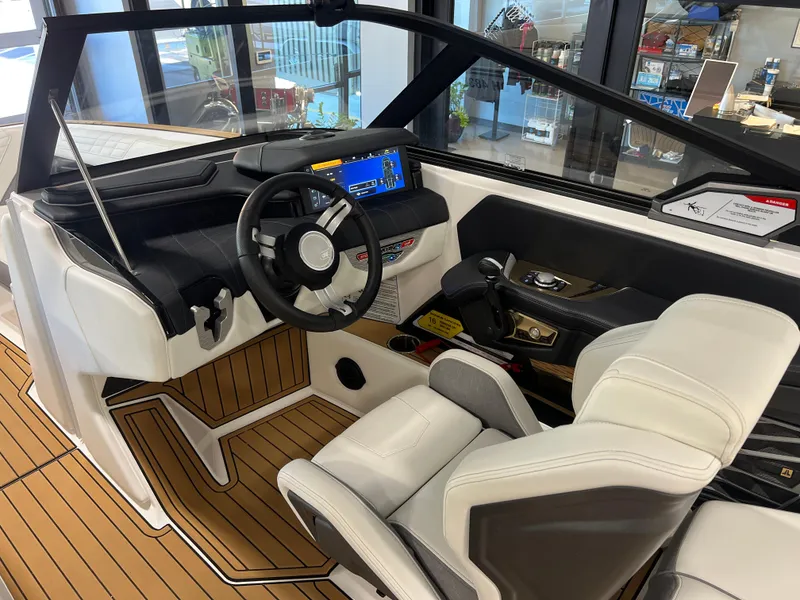 Slide: The Image of 2023 Nautique Super Air G23 boat interior with modern dashboard and steering wheel. - 38