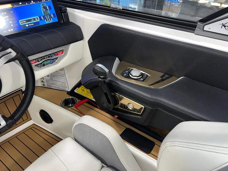 Slide: The Image of 2023 Nautique Super Air G23 boat interior with steering wheel and control panel. - 40