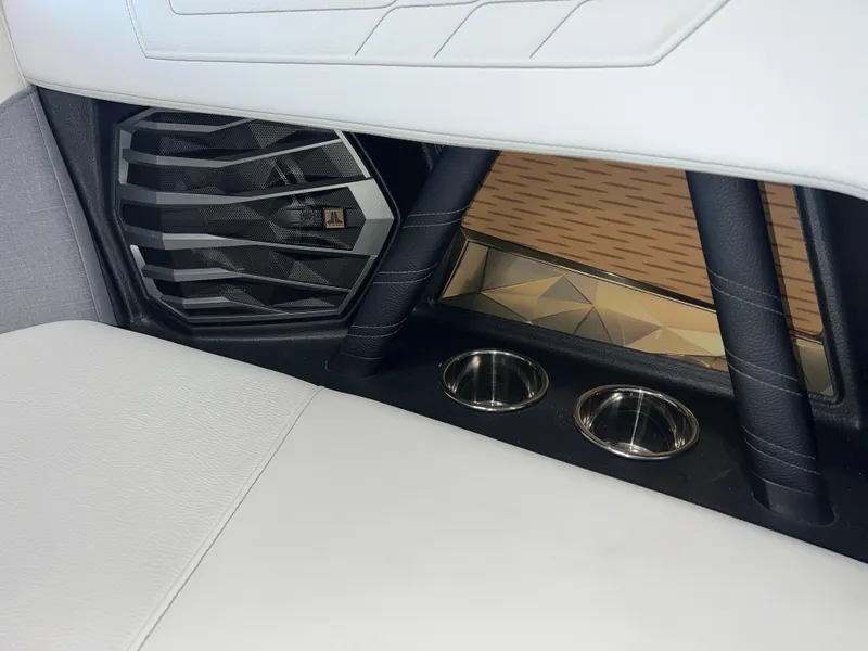 Slide: The Image of 2023 Nautique Super Air G23 interior with sleek design and cup holders. - 48